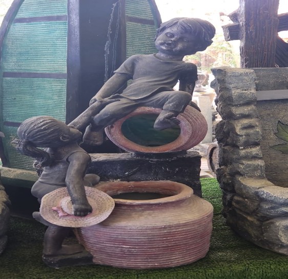 Water Fountain With Boy And Girl